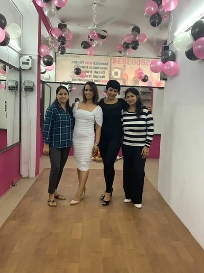 A group photo with the amazing women who came to support our new studio. The energy was incredible.