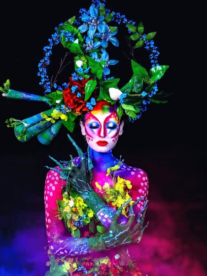 We created this nature-themed fantasy makeup during our creative course. It involves intricate body painting, floral arrangements, and custom props to bring a vision to life.