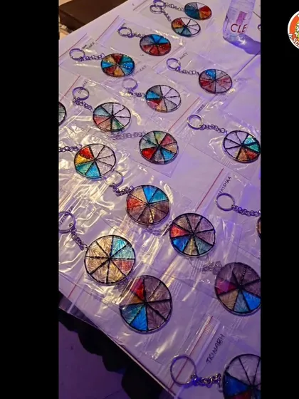 A collection of finished keychains, each one unique and sparkling. This is a great craft activity that combines art and fine motor skills.
