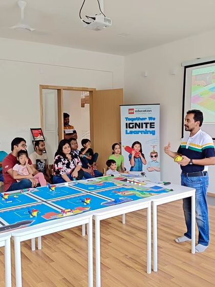 An instructor presents to a group of parents at our Whitefield orientation, explaining the benefits of our hands-on robotics programs.