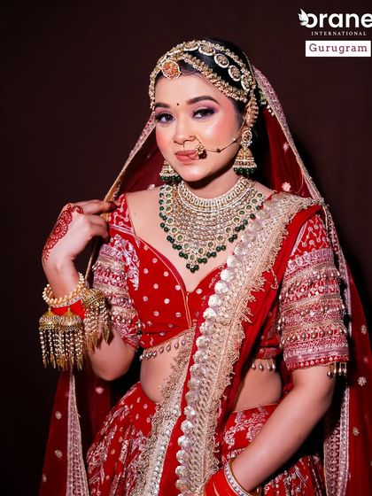 This shot shows the full bridal ensemble, highlighting the heavy jewelry and rich red lehenga. My students learn to create makeup that stands up to and complements such opulent styling.