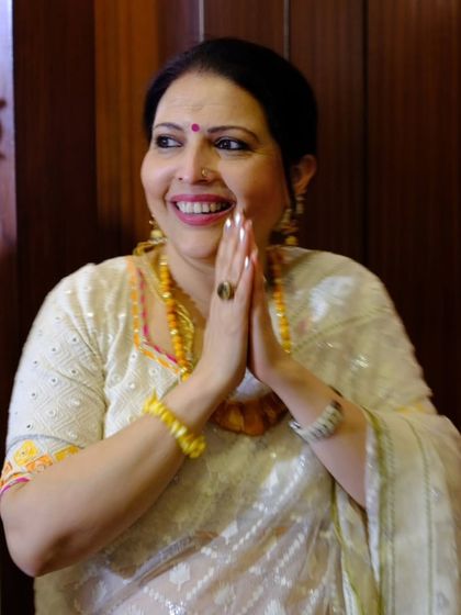 This is a picture of me, filled with gratitude and joy. My journey from being a patient to a teacher is a testament to the transformative power of Iyengar yoga and the grace of my Guru.