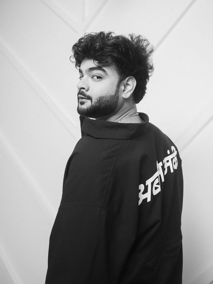 Styling for the 'Kota Factory' promotions. This look features a black jacket with a cool graphic print on the back, reflecting a modern and youthful streetwear style.