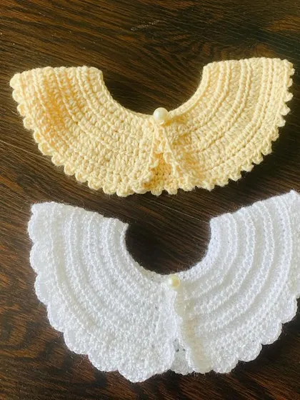 My detachable crochet collars are perfect for a quick and elegant style update. This image shows two of the available colors, white and a soft yellow, both featuring a delicate scalloped edge and a pearl button clasp. They work beautifully on both adult tops and kids' dresses.