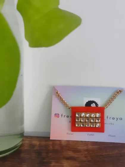 A simple and elegant fabric necklace with a square Kundan pendant. This piece is perfect for both western and traditional outfits, adding a touch of sparkle to your look.