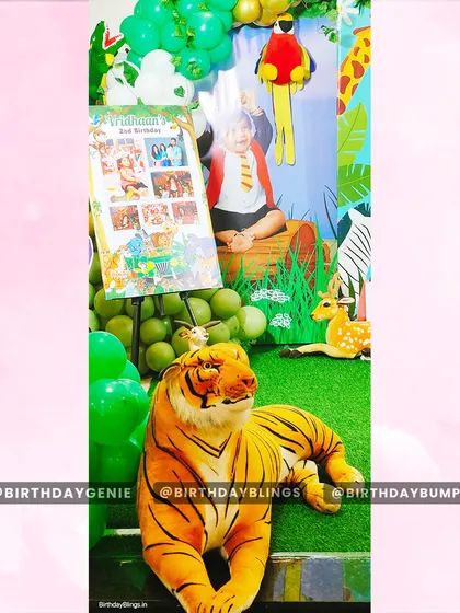 A view of the jungle party setup, showing the placement of the photo collage easel next to the main stage.
