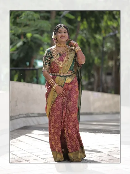A full-length portrait of the bride. Her elegance and grace are on full display, with her makeup and hair perfectly styled to complement her traditional attire.