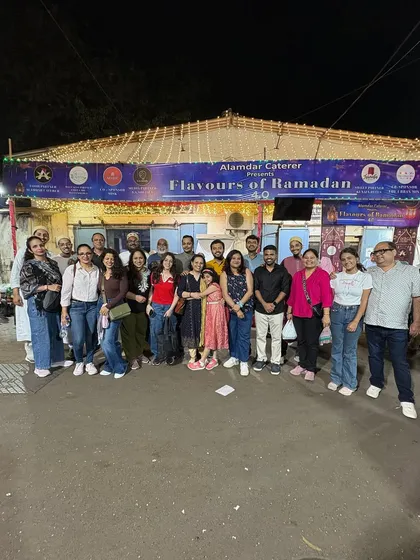A large group of guests posing together. We love seeing our space filled with such happy and energetic crowds.