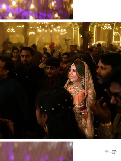 A candid shot of the bride amidst her family and friends, her face lit up with joy. This photo captures the communal spirit of a wedding celebration.