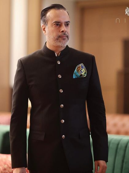 As the founder, I often wear my own creations. For this event, I chose a classic black bandhgala suit with striking golden buttons, a look that is both traditional and modern.