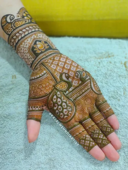 A peacock-themed design on the palm.