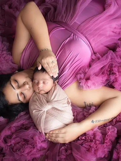 There is nothing more precious than the bond between a mother and her newborn. This overhead shot, surrounded by soft tulle, creates a dreamy, angelic portrait of your new baby.