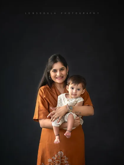 A mother and her baby share a sweet moment. These individual portraits within a larger family session are perfect for highlighting each unique relationship.