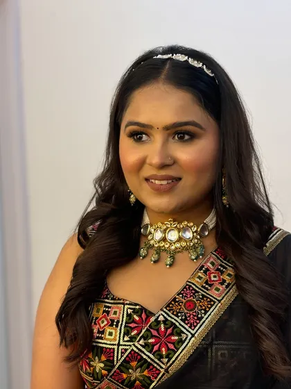 Another angle of the party look, highlighting the soft waves in her hair and the beautifully blended makeup.