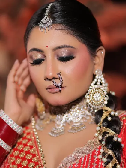 Another angle of this stunning red bridal look. The soft contouring and blush add dimension to the face without looking harsh.