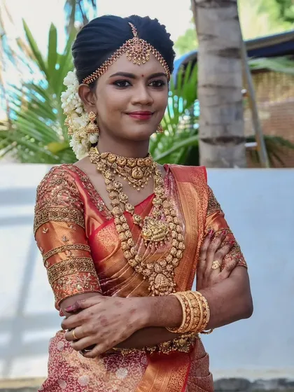 Swapna looking confident and beautiful on her wedding day. The outdoor lighting shows how well the makeup holds up, looking natural and not heavy.