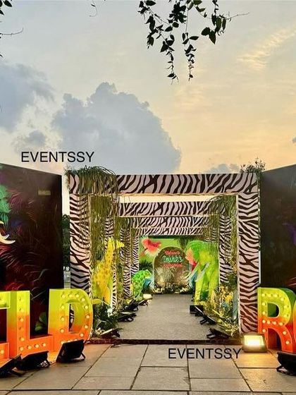 A dramatic 'Wild Roar' entrance with large marquee letters and glowing animal silhouettes, setting the stage for a neon jungle party.