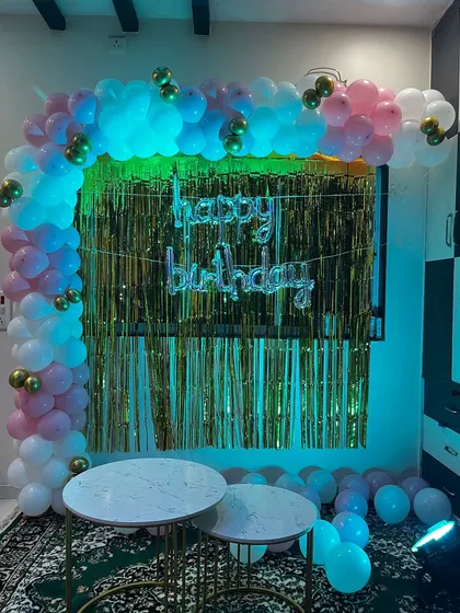 Here is the same L-shaped balloon arch with different lighting. The added blue and green lights completely change the mood, showing how versatile a simple setup can be.