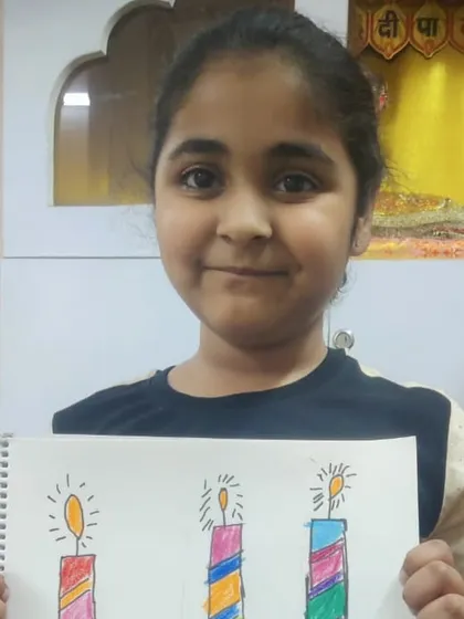 A student proudly shows her drawing of colorful birthday candles. This simple subject is great for practicing straight lines and patterns.