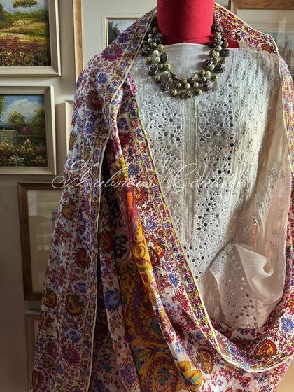 A draped view of the suit with the colorful dupatta, showing how it can be styled for a more vibrant look.