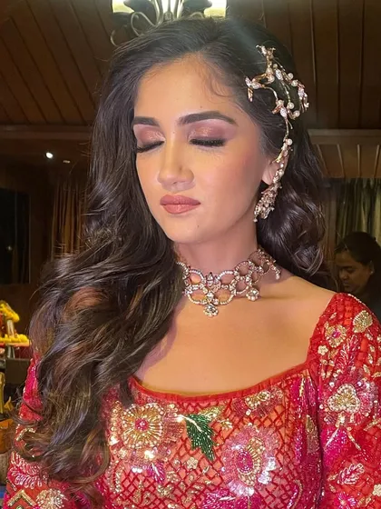 A close-up of the sangeet look, showing the soft makeup and beautiful hair.