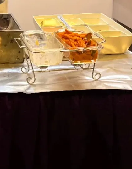 The toppings and sauces for the live pasta station at the 'Fortnite' party. Offering choices allows kids to build their own perfect plate of pasta.