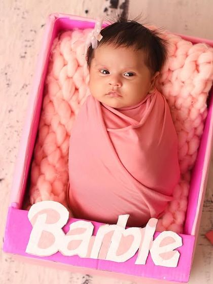 Another take on our popular 'Barbie' theme, this shot shows the full set with all the iconic accessories, creating a picture-perfect scene for your newborn girl.
