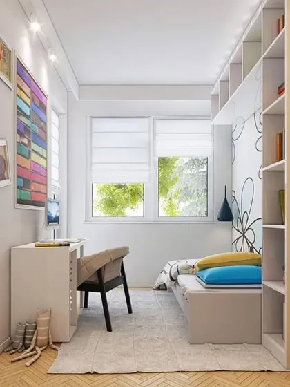 We excel at designing functional and stylish solutions for compact spaces. This small study or bedroom uses clever built-in shelving and a minimalist desk to maximize utility without feeling cluttered, creating a bright and efficient personal area.