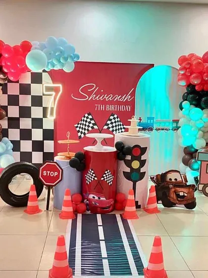 We pulled out all the stops for Shivansh's 7th birthday with a Disney Cars theme. The setup included a custom road runner, traffic signs, character cutouts of Mater, and a vibrant balloon display.