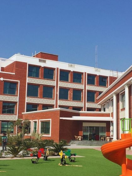 The play area at Prayag International School, with the Junior Block in the background. The design ensures that learning and recreational spaces are well-integrated and aesthetically pleasing.
