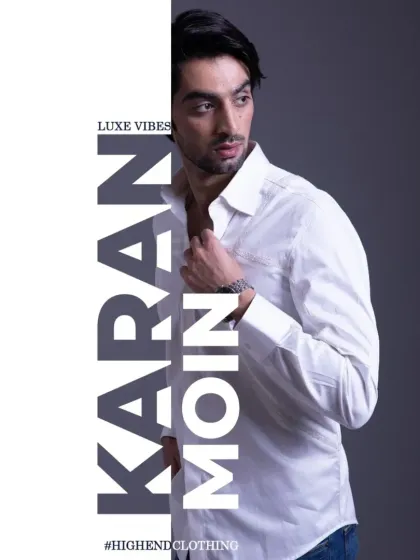 A classic white shirt with subtle pintuck detailing. This is not just a shirt, it's a masterpiece of understated elegance.