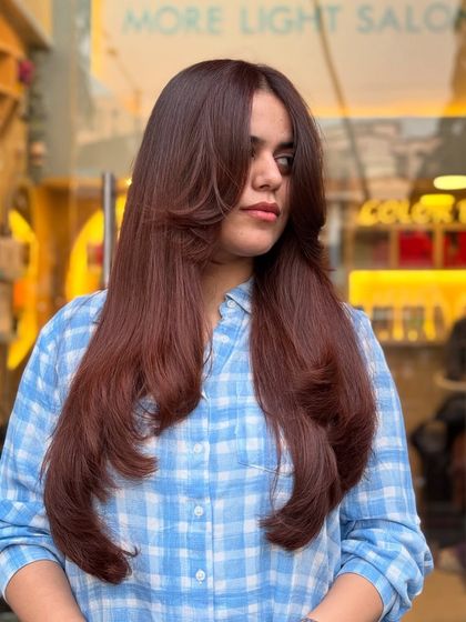 This global hair color blends copper and brown hues for a look that makes a big statement with subtle, sophisticated touches.