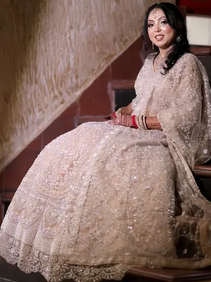 The bride-to-be looking radiant and happy. The makeup is designed to look stunning both in person and in professional photos.