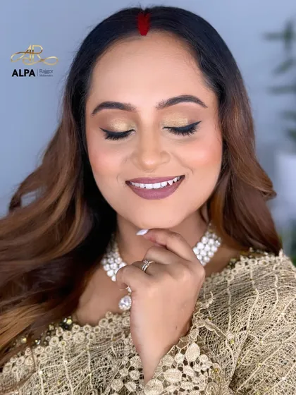 A serene, eyes-closed shot that shows the smooth application of the eyeshadow and the flawless base.