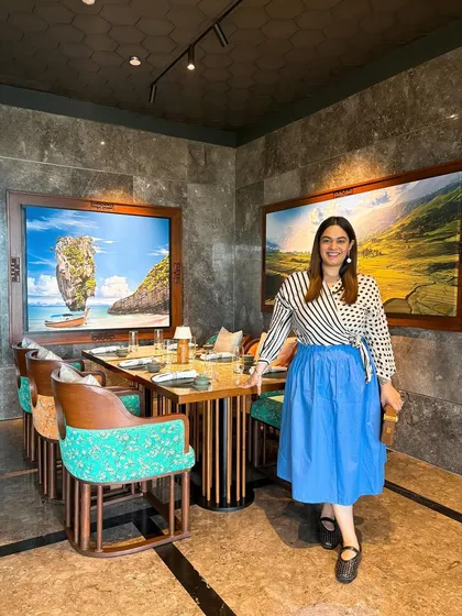 Posing inside 32 East to showcase the beautiful interiors and my personal style. This connects the dining experience to a lifestyle narrative, showing my audience how to enjoy the space.
