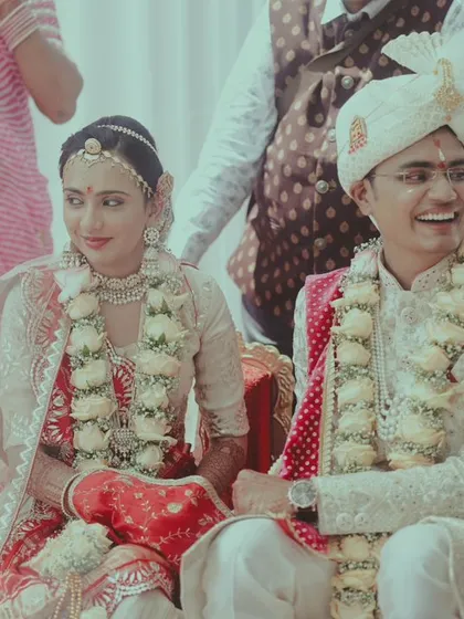 A candid shot of the couple enjoying their wedding ceremony.