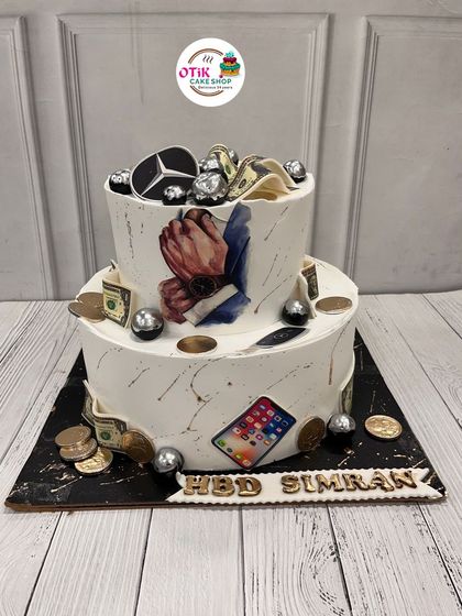 This cake is all about celebrating someone's favorite things. We incorporated edible prints of a luxury car, an iPhone, and money for a truly personalized birthday cake.