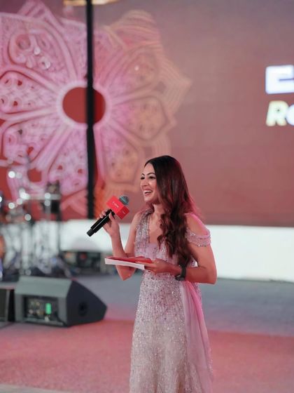 A happy moment on stage while hosting for Canon India. I bring a warm and approachable energy to corporate gigs, making guests feel comfortable and ready to participate.