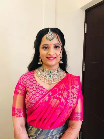 A smiling portrait of the bride. The natural-looking makeup ensures she looks like herself, just more radiant.