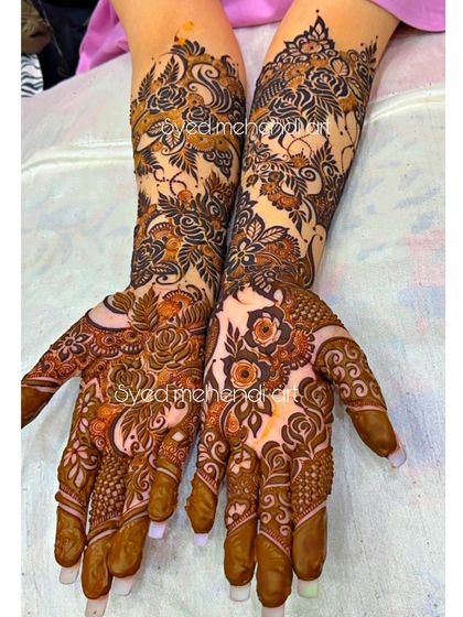 A full view of an engagement design, showing the symmetrical patterns and heavy coverage.