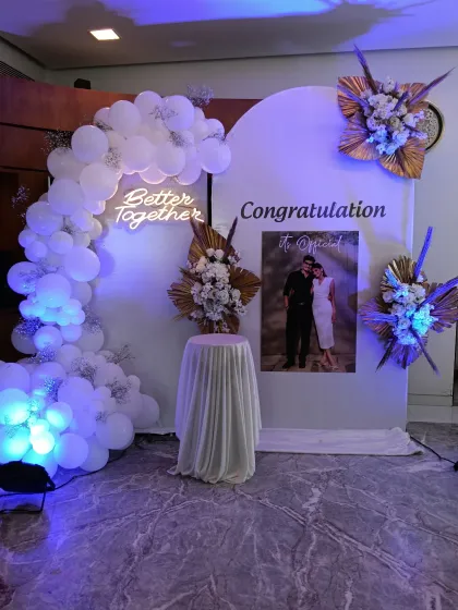 A modern backdrop that incorporates a personal photo. The "Congratulation" message and "Better Together" neon sign are paired with a lovely picture of the couple.