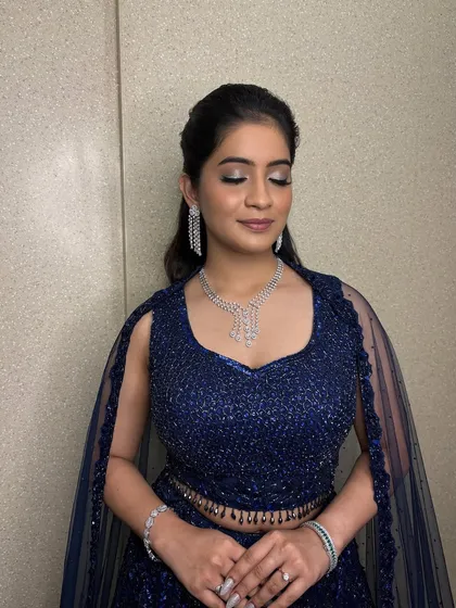 This is what I mean by shimmer. For this Sangeet night, I created a captivating silver and blue smokey eye that sparkles with every glance. It's a bold statement that is still elegant and refined.