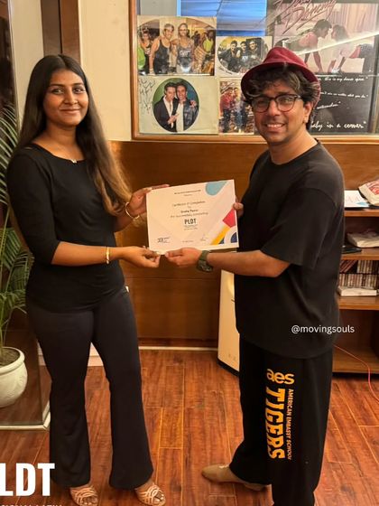 A student receives her certificate upon completing the PLDT course. We are proud to see our dancers grow and achieve their goals.