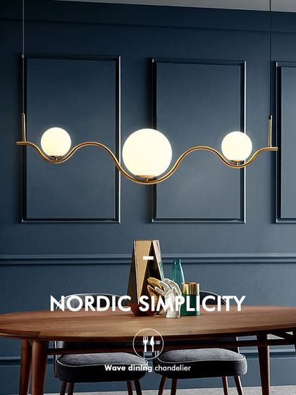 This image highlights the Nordic simplicity of our wave dining chandelier. It's a minimalist design that makes a big impact, perfect for contemporary homes.
