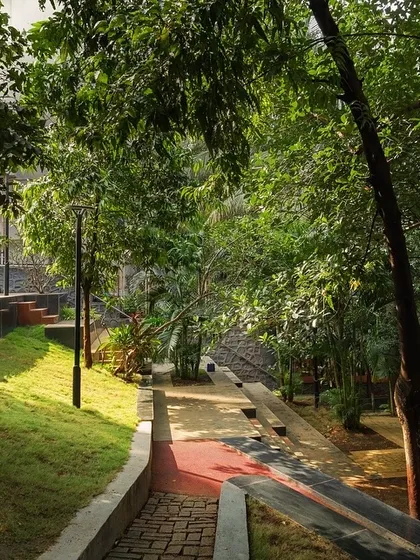 Nepean Greens in Mumbai, a public plaza we designed by transforming a neglected garden and steps into a versatile community space with lush lawns, terraces, and accessible ramps.