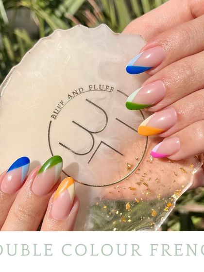 A pop of color makes everything better. This gallery shows how a simple French tip can be transformed with vibrant shades like blue, green, yellow, and pink for a playful look.