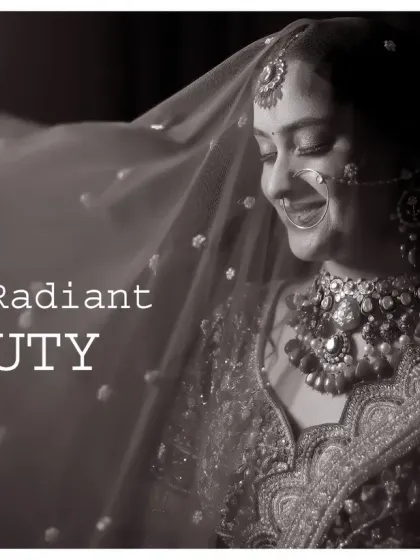 This black and white bridal portrait is all about radiance. The soft light on the bride's face and the delicate details of her veil create a dreamy and ethereal image that is truly timeless.