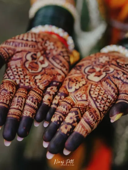A close-up of the intricate patterns on the palm after the henna paste has been removed. The dark stain shows the quality of the natural henna used.