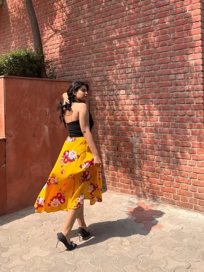 A bright and sunny look for a day on campus. I paired a simple black tube top with a flowy, yellow floral midi skirt and black heels for an effortlessly chic vibe.