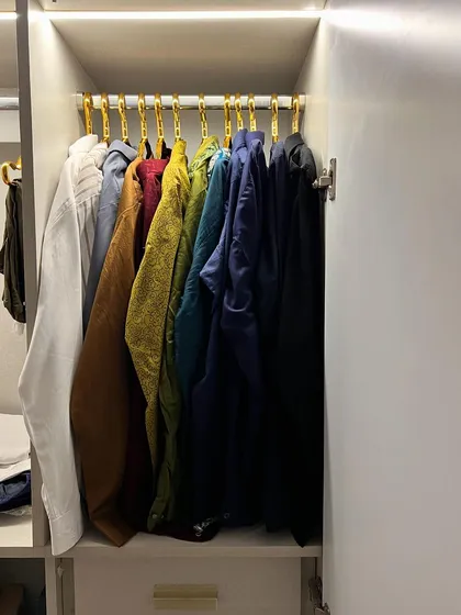The power of color coding and uniform hangers. This simple change creates a clean, streamlined look in any closet.